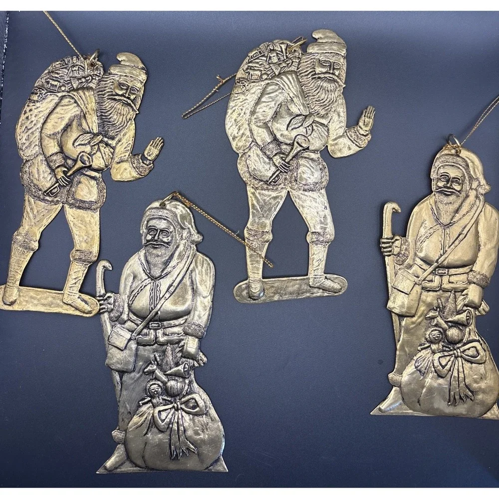 4 Vintage pressed‎ metal Santa with Gift Bag Christmas Tree ornaments aprox 6in.